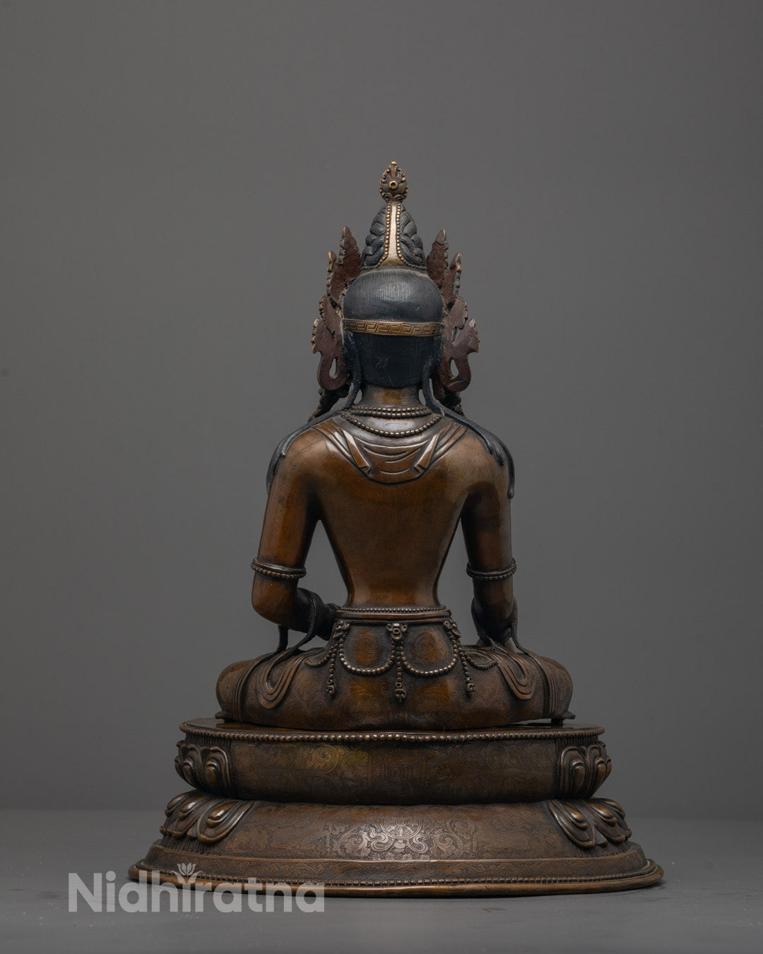 Back view of Traditional Jowo Shakyamuni Buddha seated on double-layered lotus base