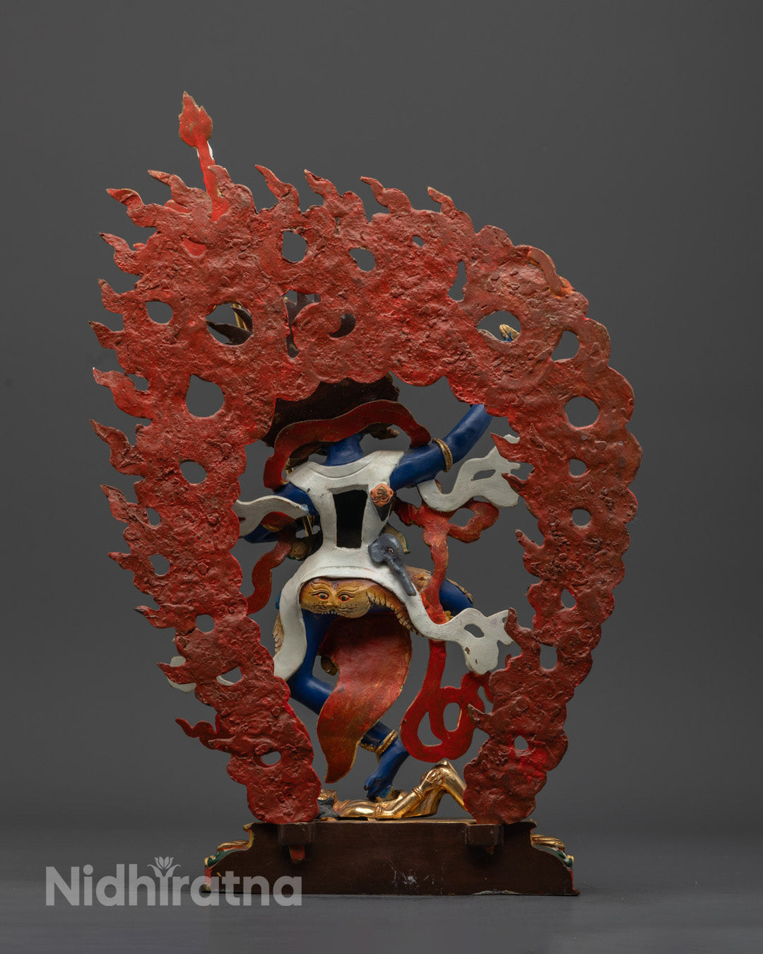 Back view of Troma Nagmo sculpture highlighting intricate copper and painted details