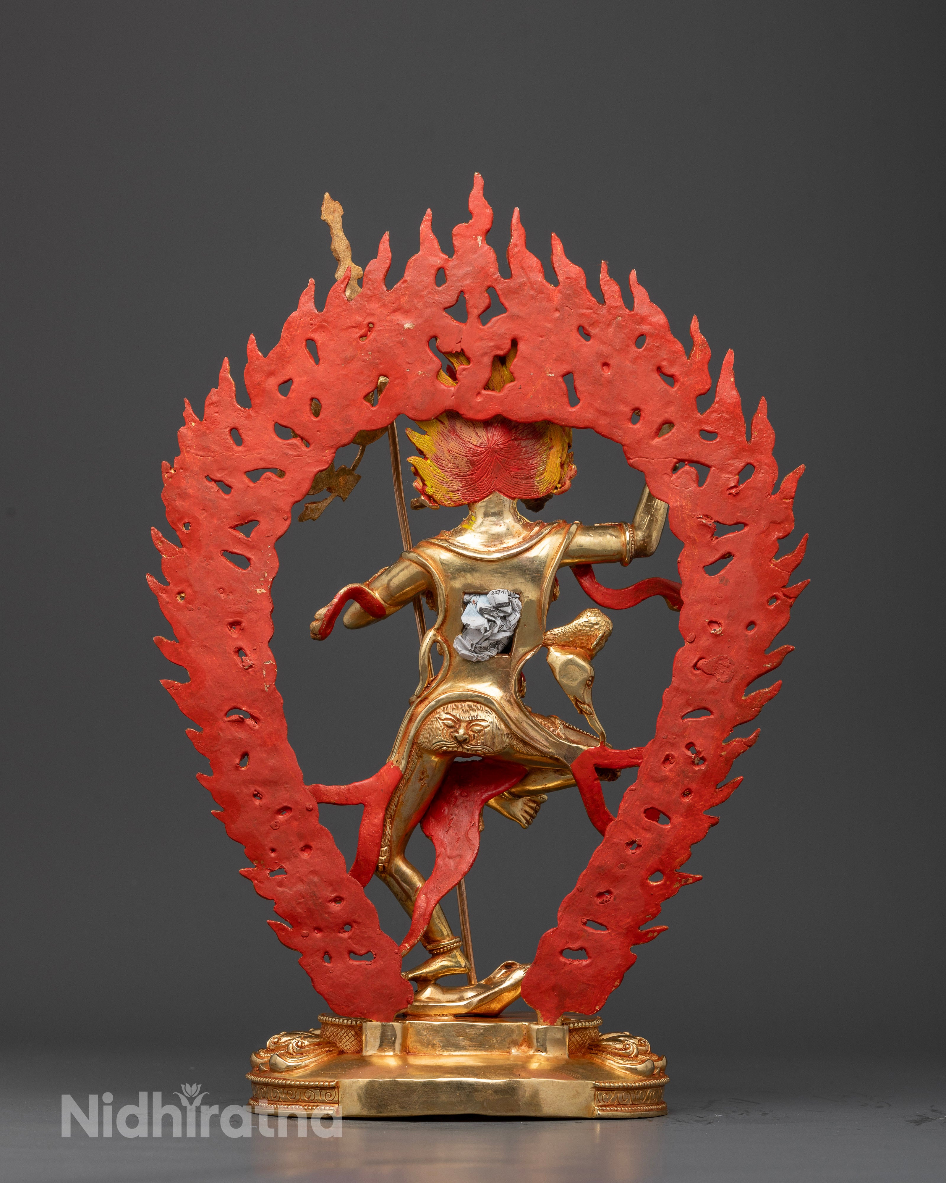 Back view of Troma Nagmo statue showing bone ornaments and flowing robes of wrathful deity