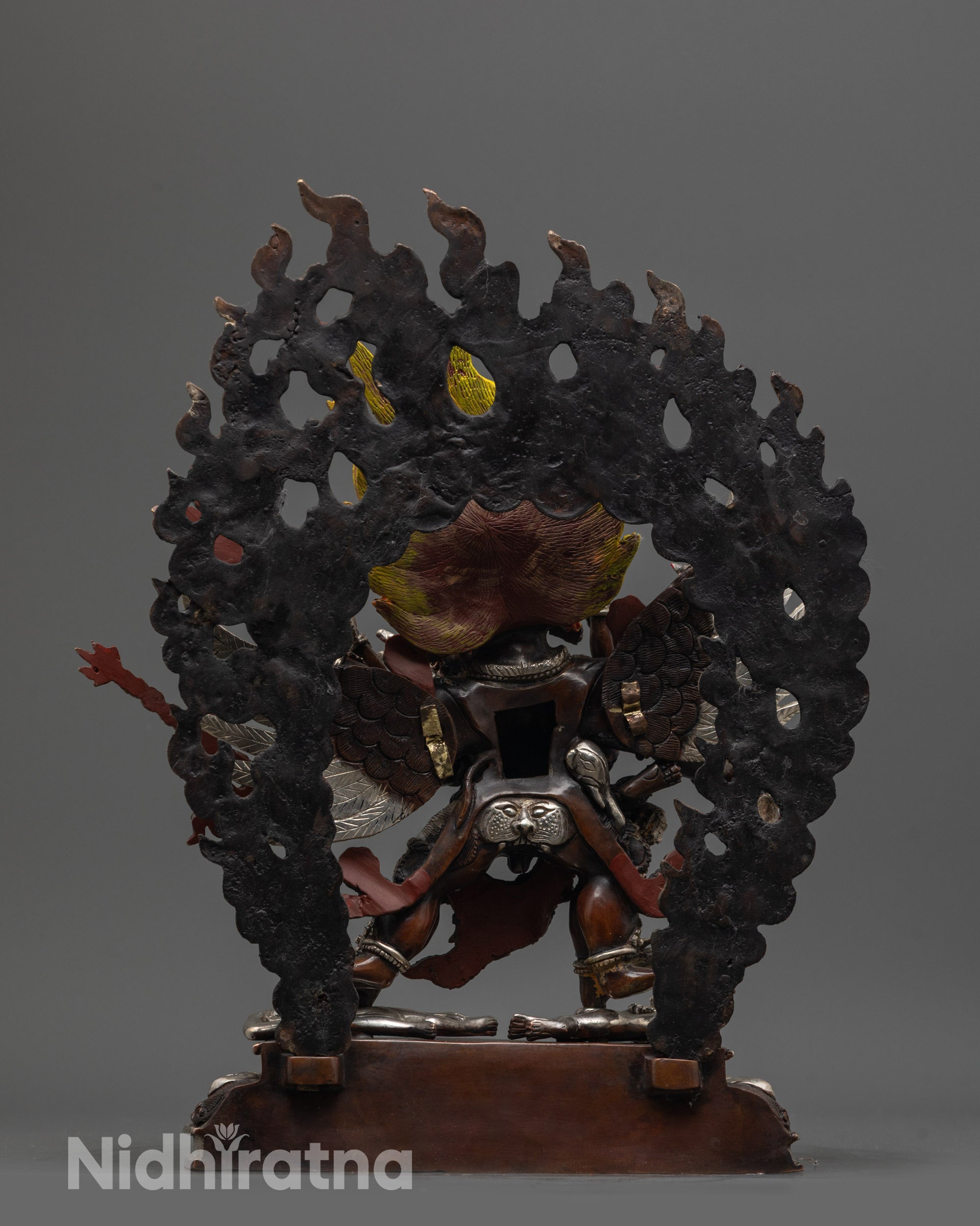 Back view of Vajrakilaya Statue featuring intricate carvings 