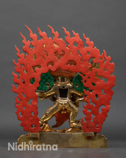 Back view of Vajrakilaya statue, ornate lotus base and feathered wing details