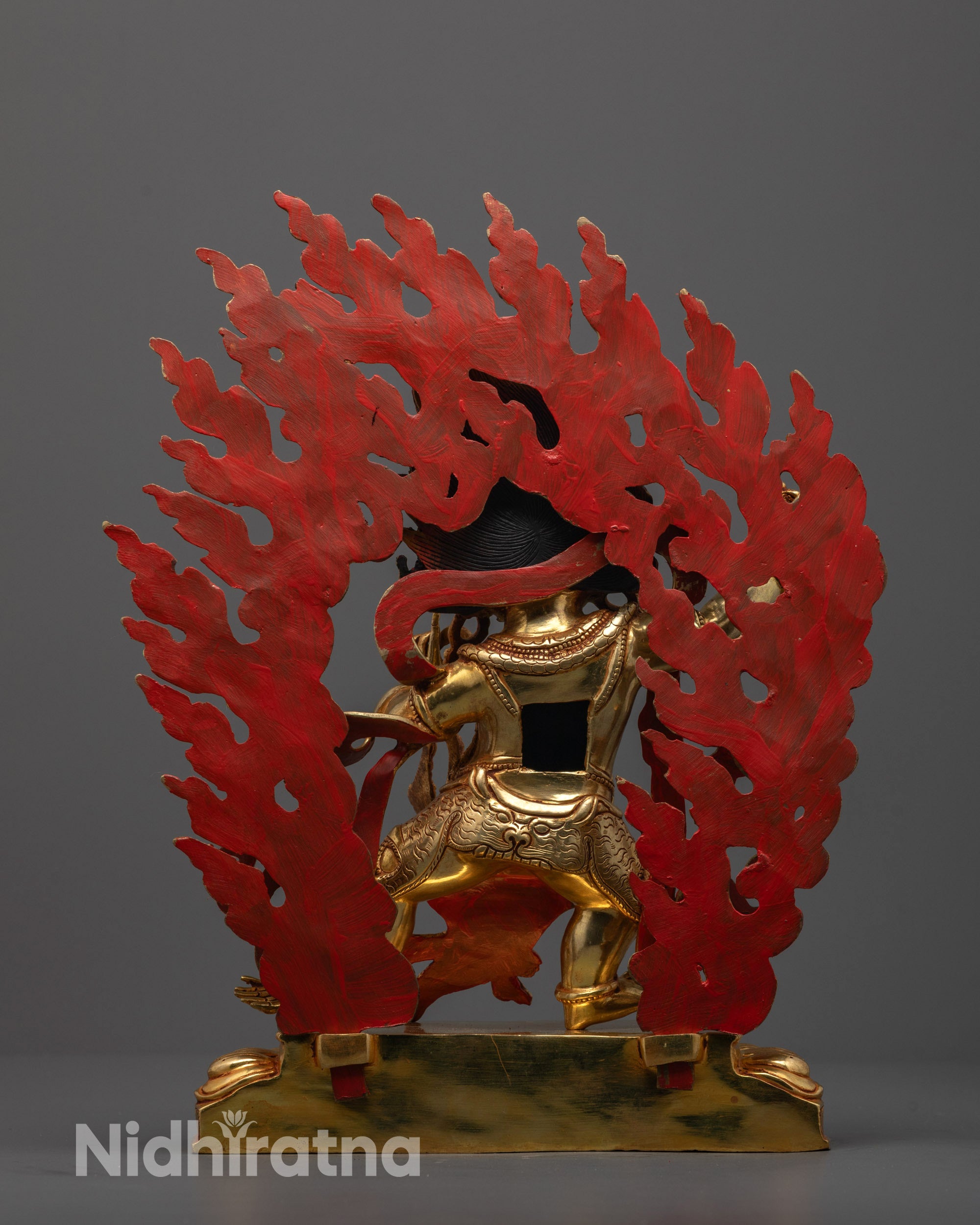 Back view of Vajrapani Statue highlighting dynamic flames and detailed halo carvings