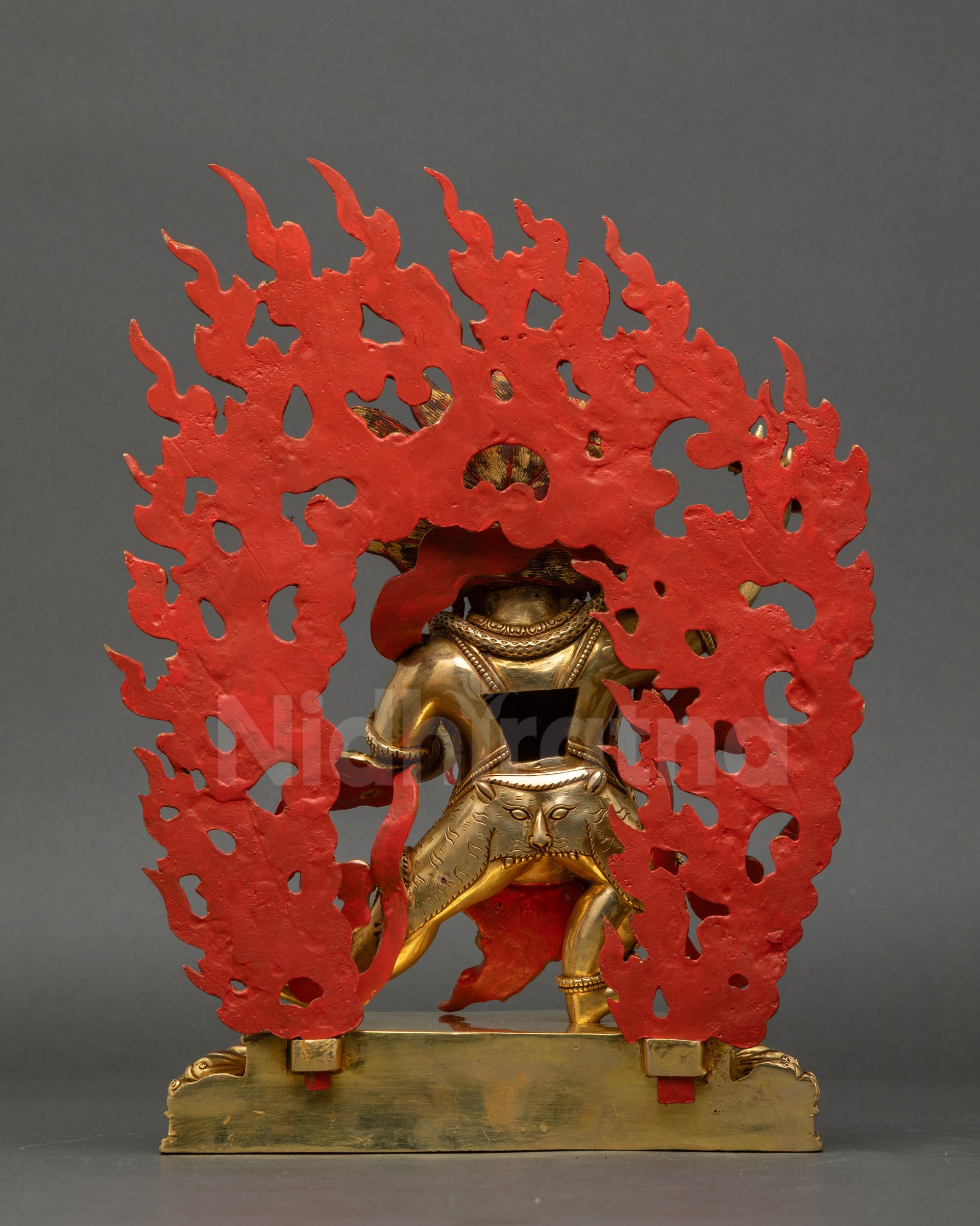 Back view of Vajrapani Statue highlighting layered fire-gilding and finely carved copper details