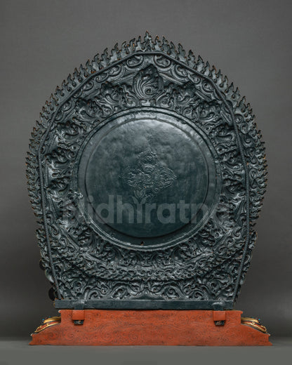 Back view of Vajrapani Statue with detailed flaming halo and traditional lotus base