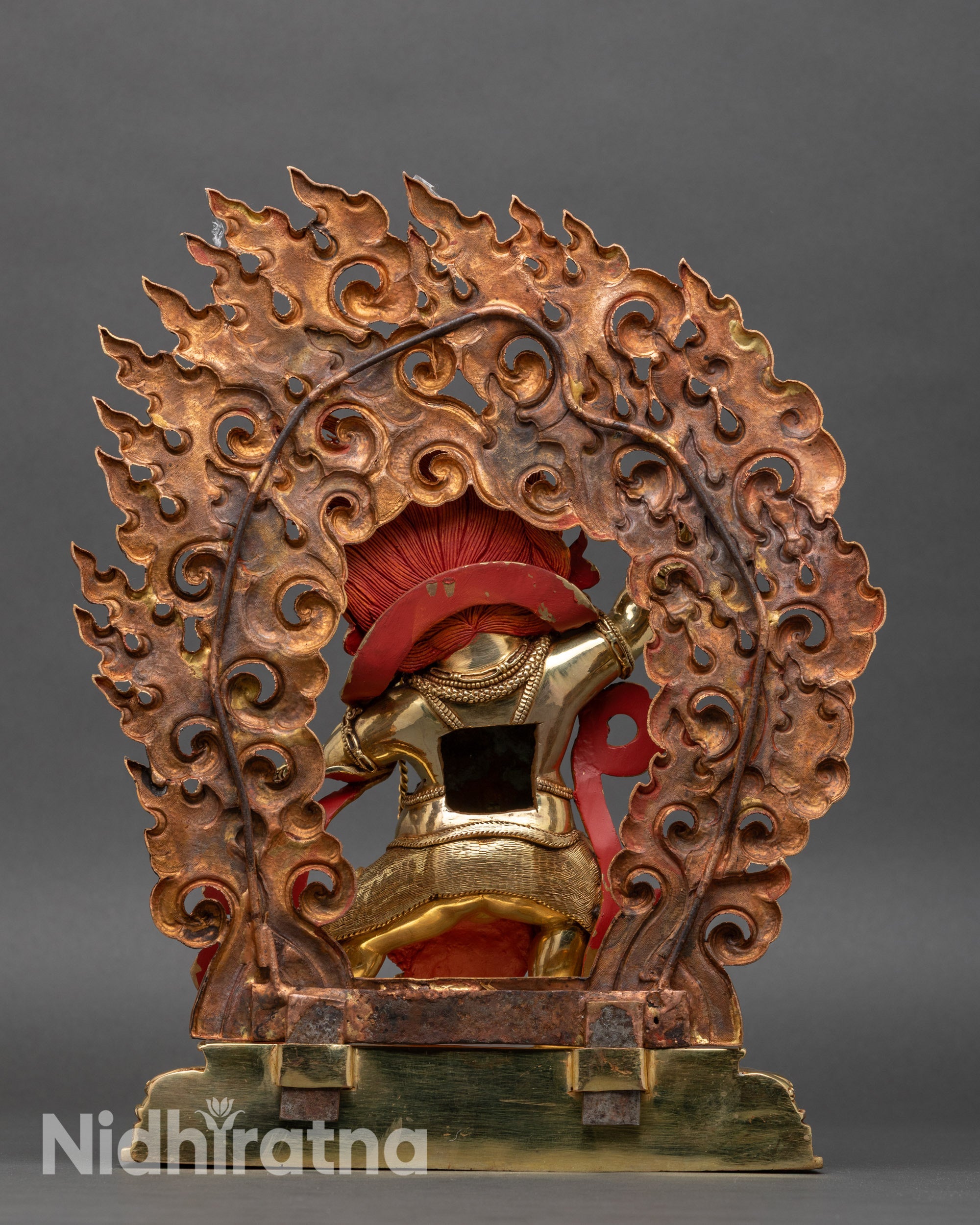 Back view of Vajrapani sculpture, lotus throne and sacred halo, Nepalese copper artistry