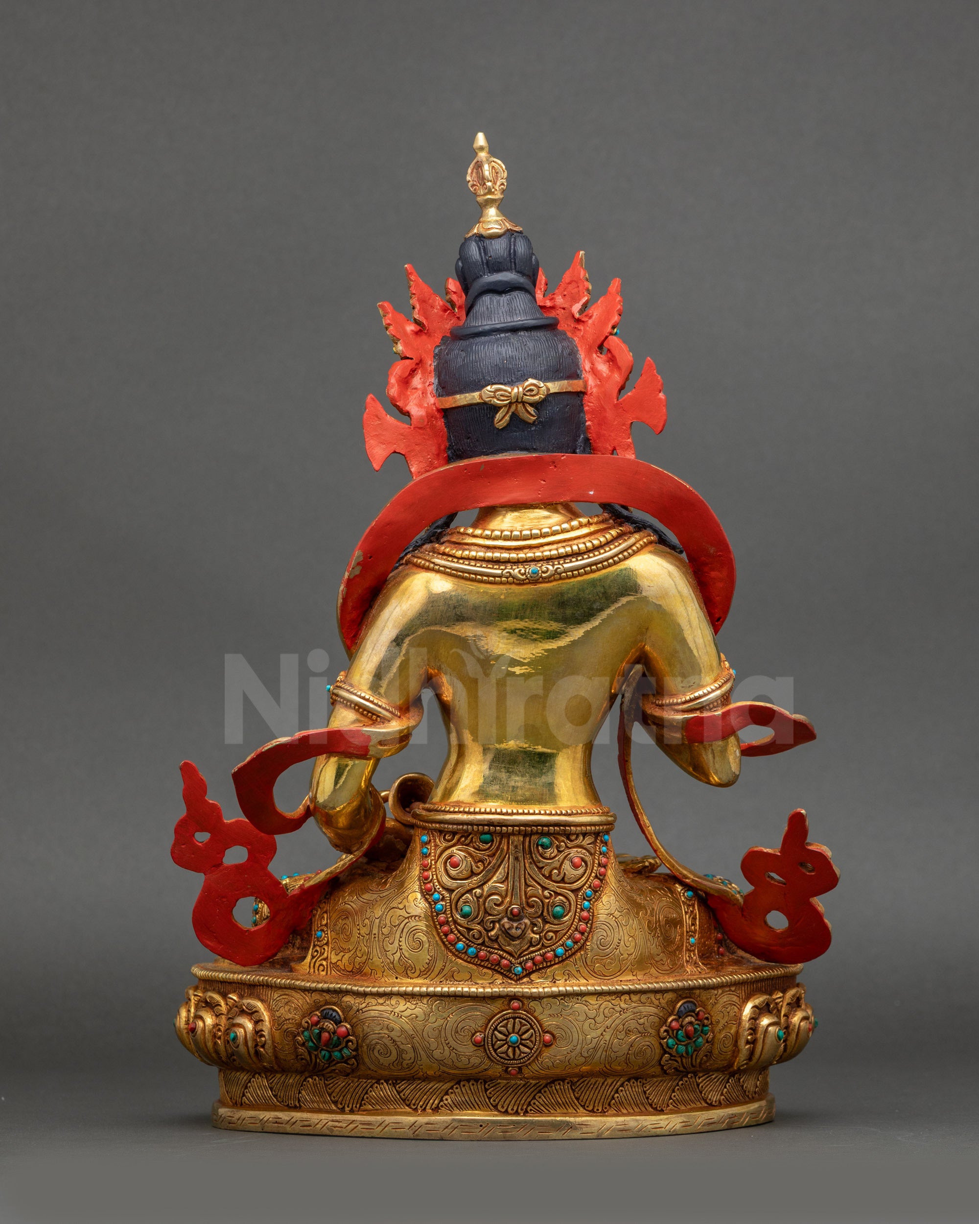 Back view of Vajrasattva Statue displaying gold fire-gilding and carved copper surface
