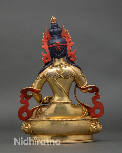 Back view of Vajrasattva idol showing detailed lotus seat and swirling robes