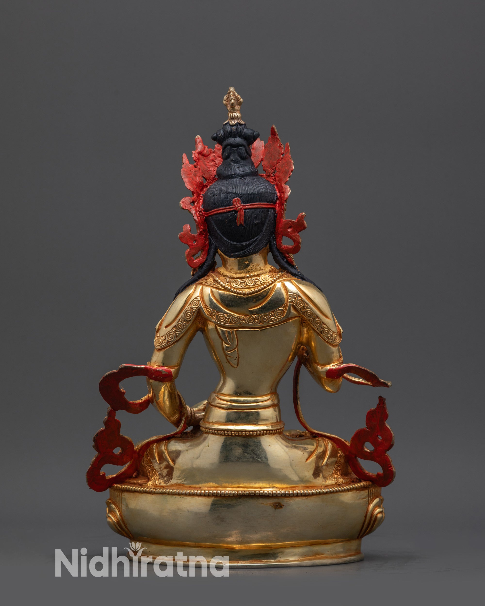 Back view of Vajrasattva statue highlighting carved patterns, lotus seat, and ornate robe details