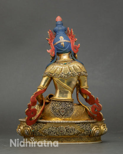 Back view of Vajrasattva statue revealing lotus base and intricately carved details