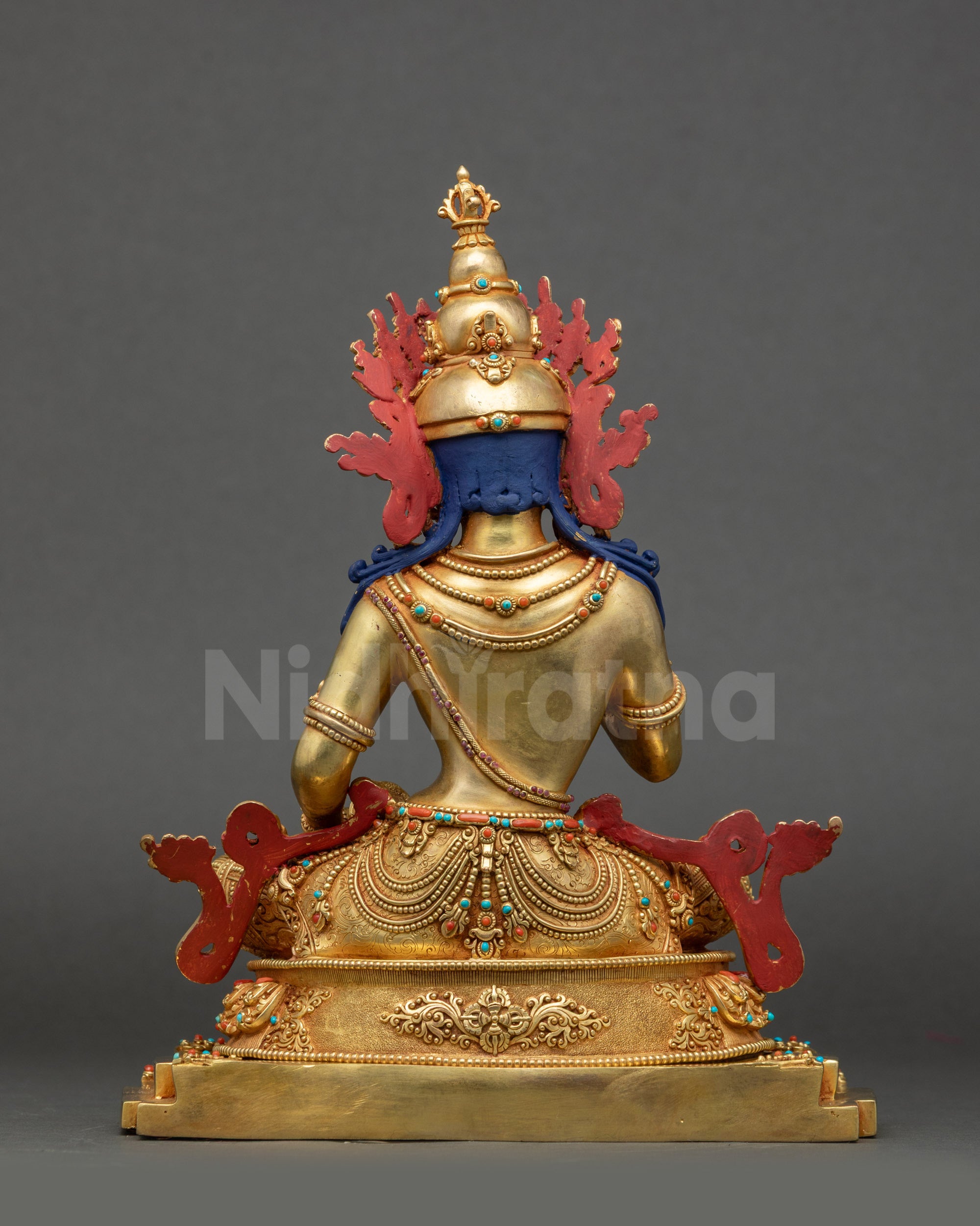 Back view of Vajrasattva statue showing five-jewelled crown and carved copper details