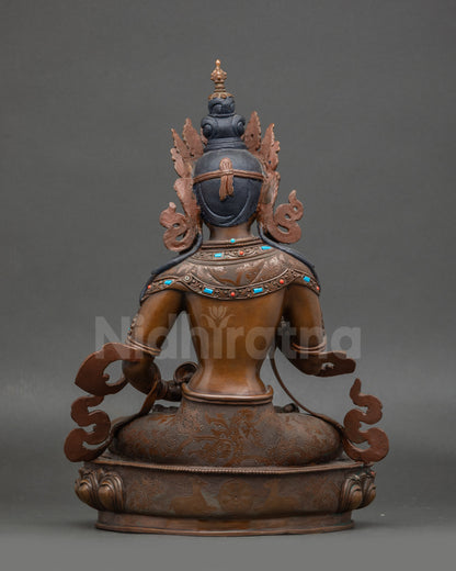 Back view of Vajrasattva statue with detailed lotus seat and spiritual motifs