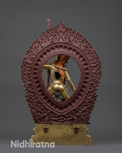 Back view of Vajrayogini statue with flaming halo and detailed carved robes Nepal