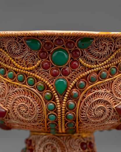 Back view of Water Offering Bowl on altar with silver-plated finish and gemstone accents