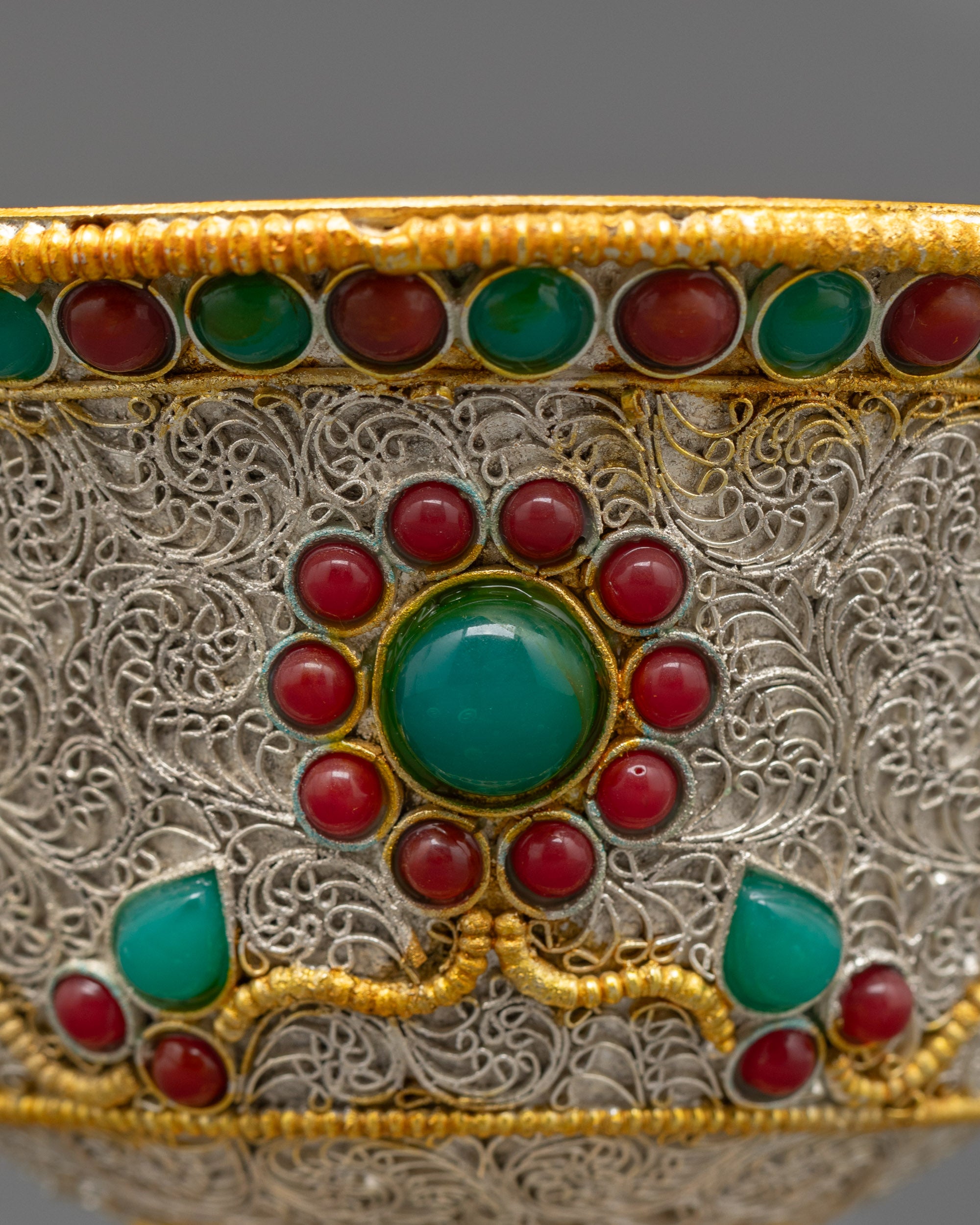 Back view of Water Offering Bowl on altar with silver-plated finish and gemstone accents