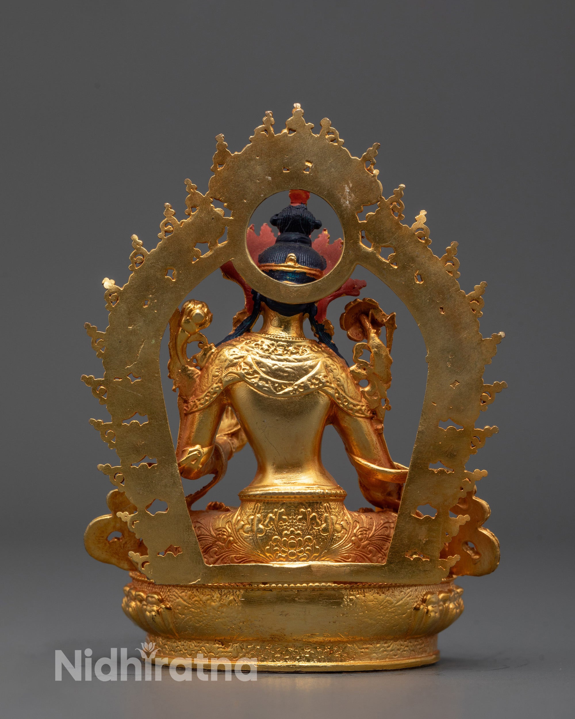 Back view of White Tara Statue highlighting consecration chamber and flowing robes