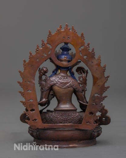 Back view of White Tara Statue highlighting oxidized copper body and lotus seat design