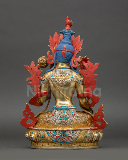 Back view of White Tara statue displaying intricate robe carving and Nepalese craftsmanship