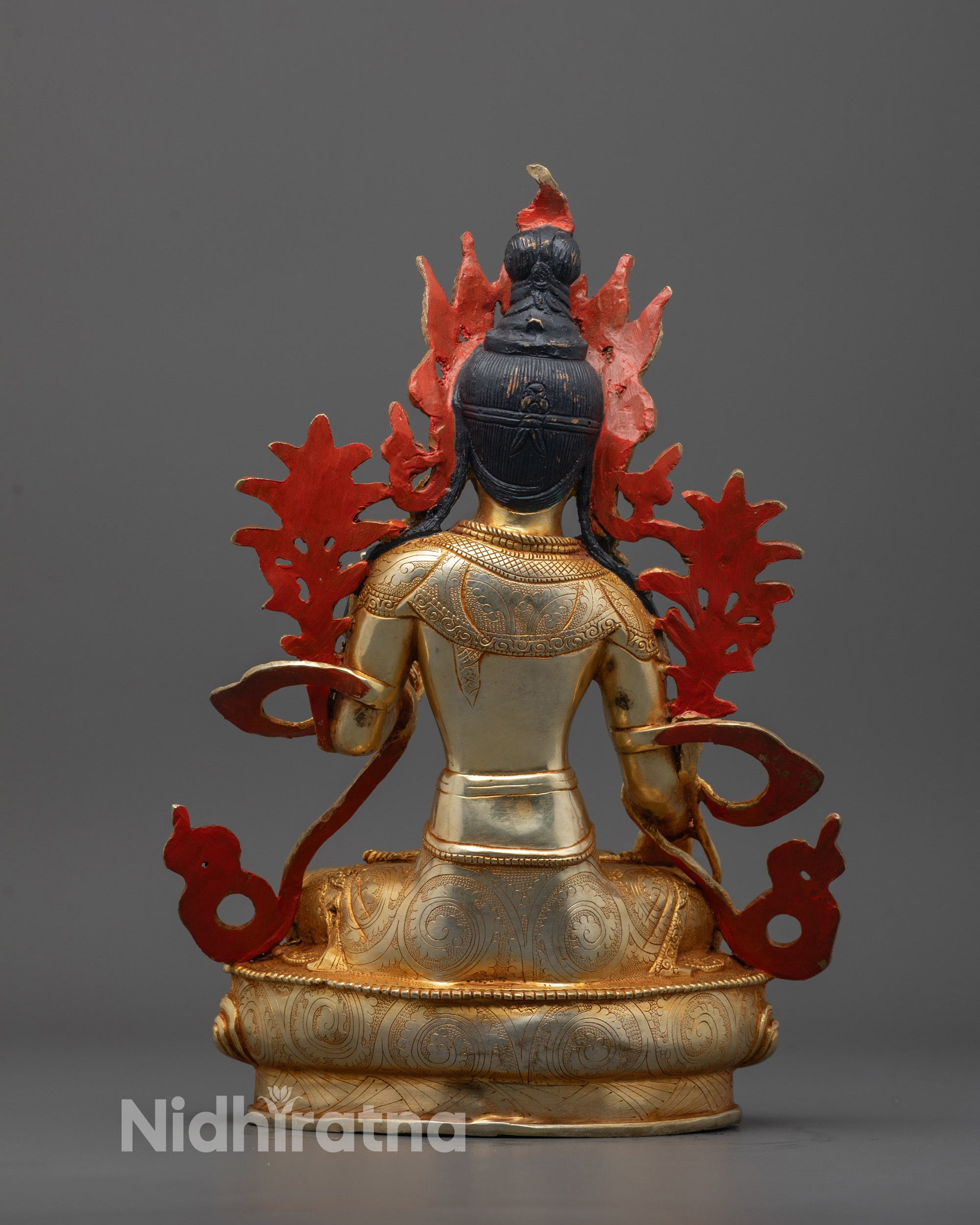 Back view of White Tara statue highlighting hollow chamber for consecration