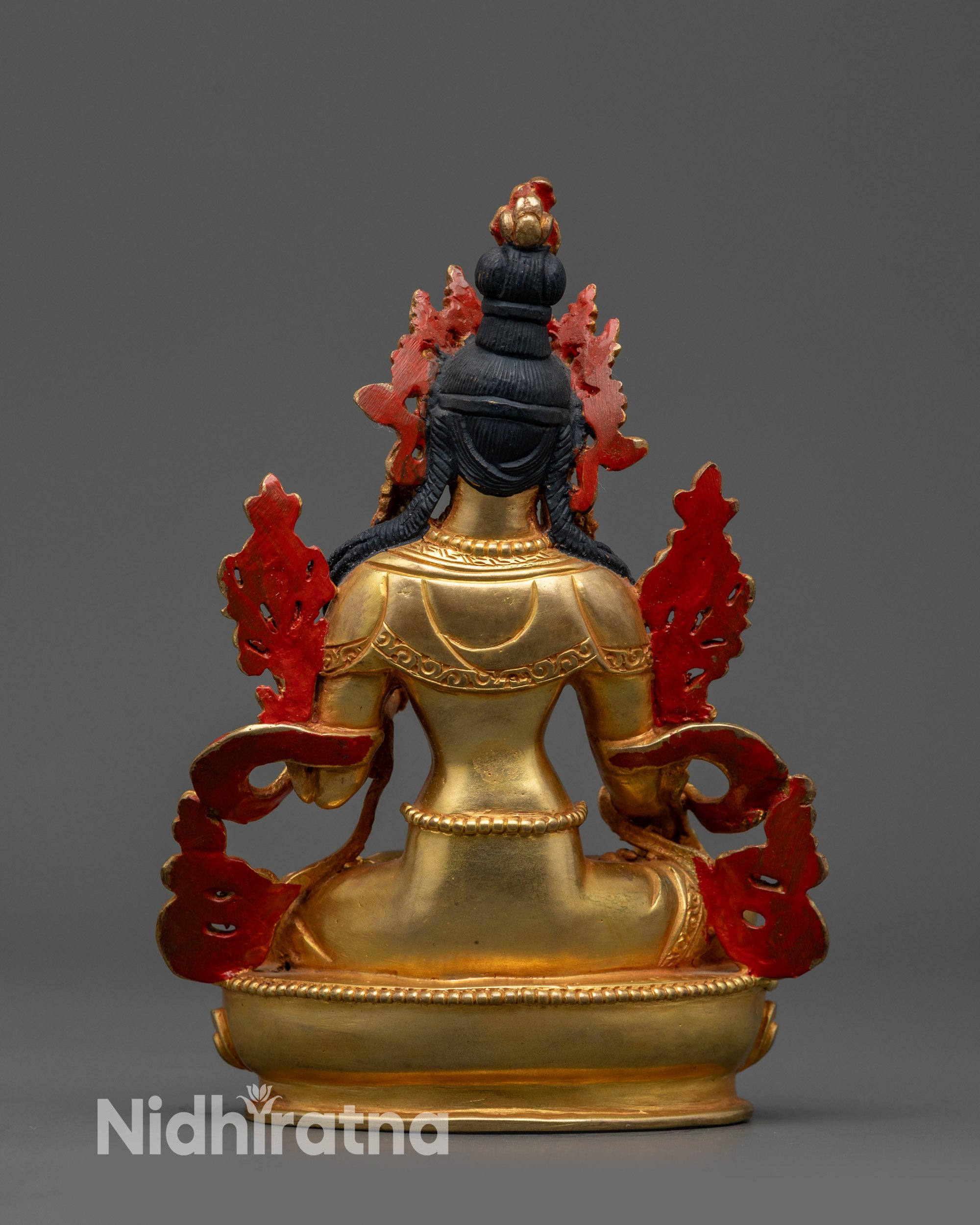 Back view of White Tara statue highlighting traditional Himalayan artistry and design