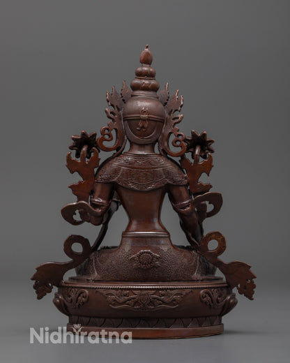 Back view of White Tara statue in oxidized copper, highlighting oxidized finish and design details