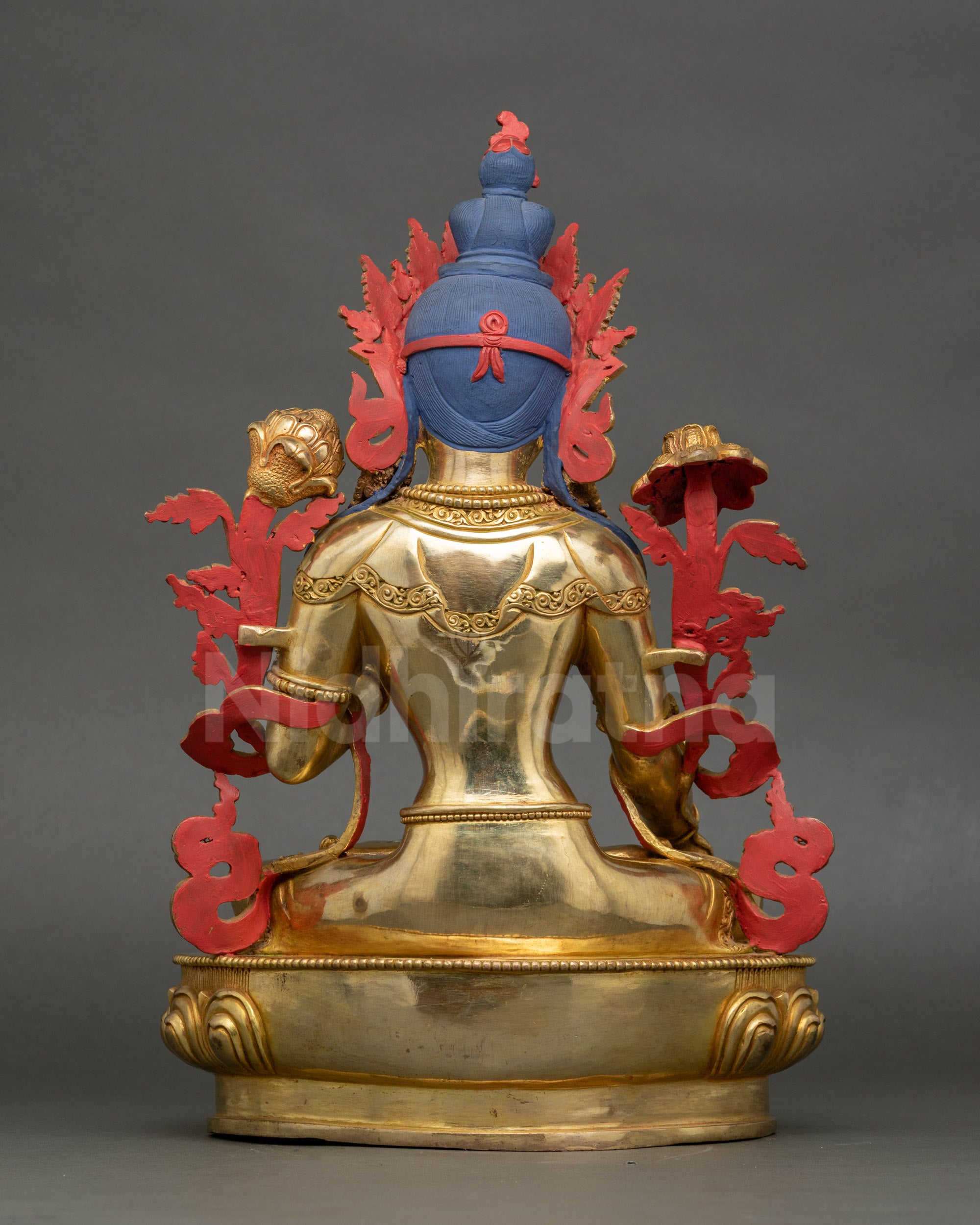 Back view of White Tara statue showing detailed crown, lotus base, and Nepalese craftsmanship