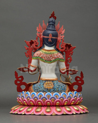 Back view of White Tara statue showing detailed lotus pedestal and flowing garments