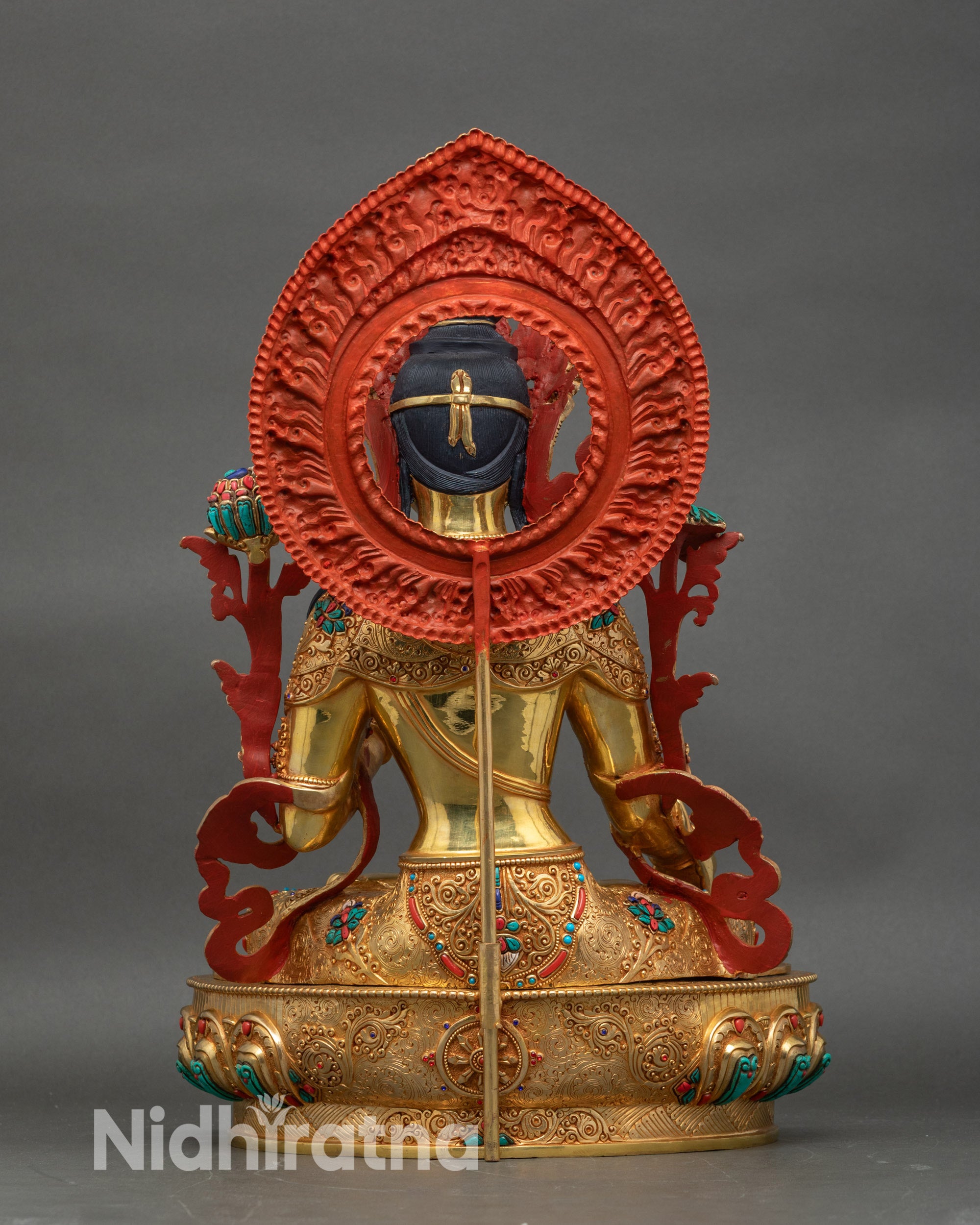 Back view of White Tara statue with lotus throne and detailed copper craftsmanship