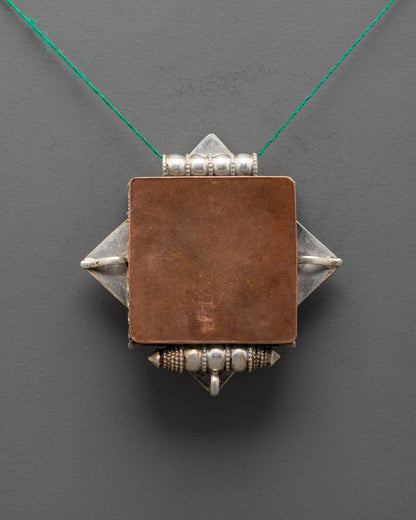 Back view of artisan-crafted Treasure Vase Locket Necklace showcasing detailed silver carving