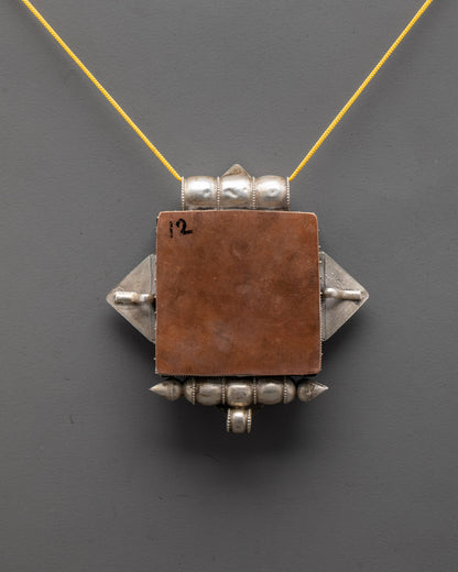 Back view of authentic Himalayan Treasure Vase Locket highlighting craftsmanship and design









Ask ChatGPT
