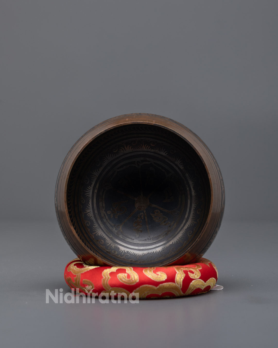 Back view of brass singing bowl used for cleansing energy and emotional healing