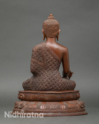Back view of copper Healing Buddha statue, lotus seat with detailed craftsmanship