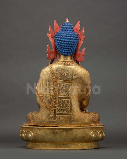 Back view of crowned Shakyamuni Buddha statue with smooth copper surface