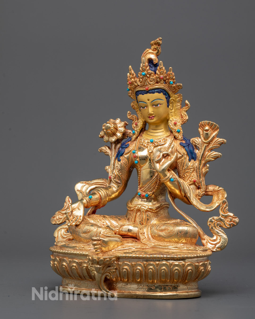 Back view of detailed carvings on fire-gilded Green Tara Traditional Statue from Nepal