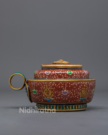 Back view of detailed copper ritual pot symbolizing purity and spiritual devotion