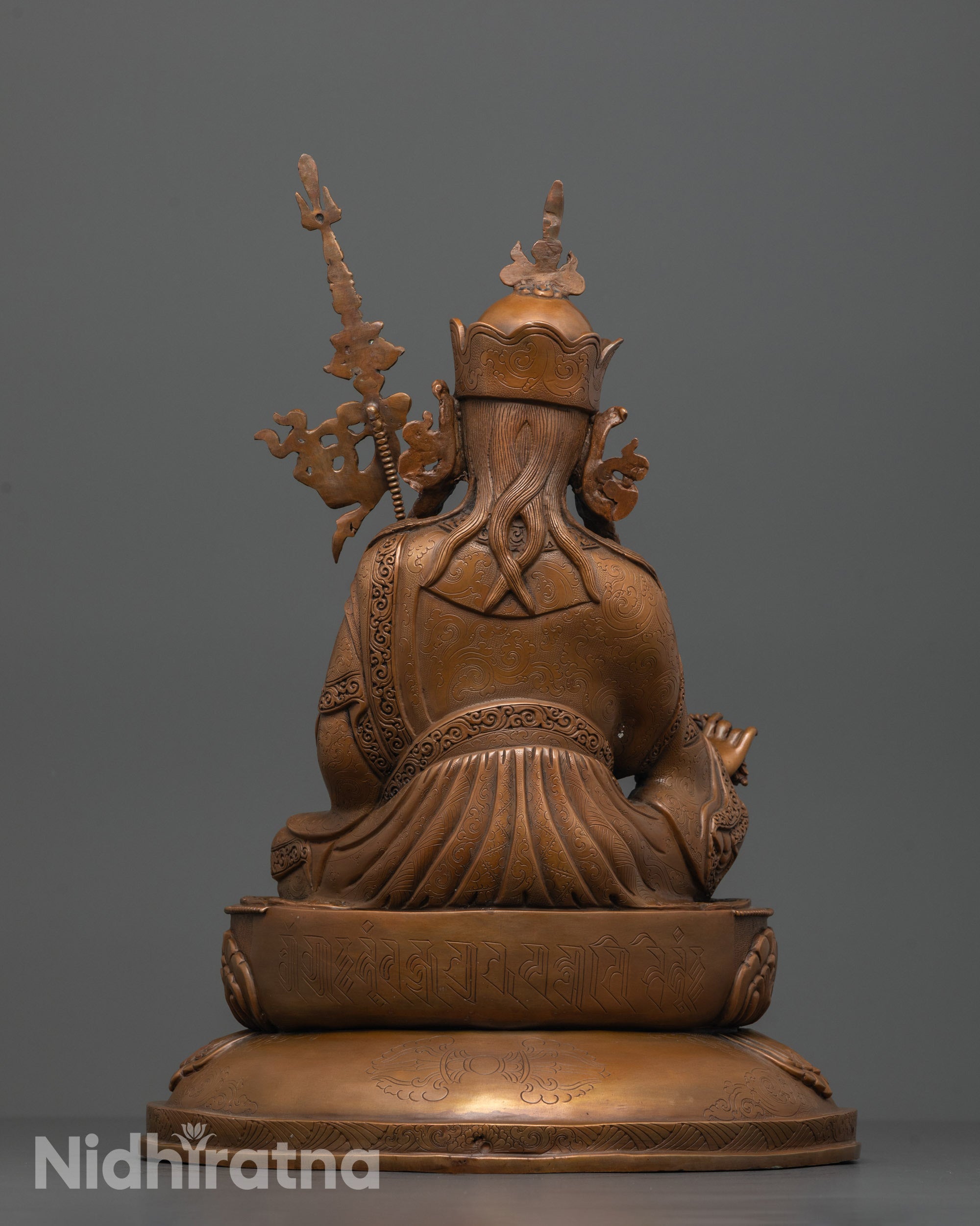 Back view of double-layered lotus seat on Guru Padmasambhava oxidized copper statue

