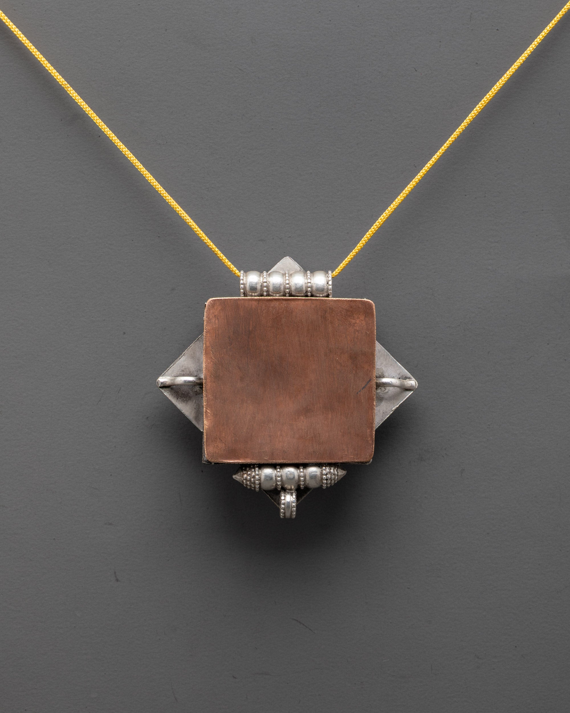 Back view of elegant Treasure Vase Locket Necklace highlighting premium silver body

