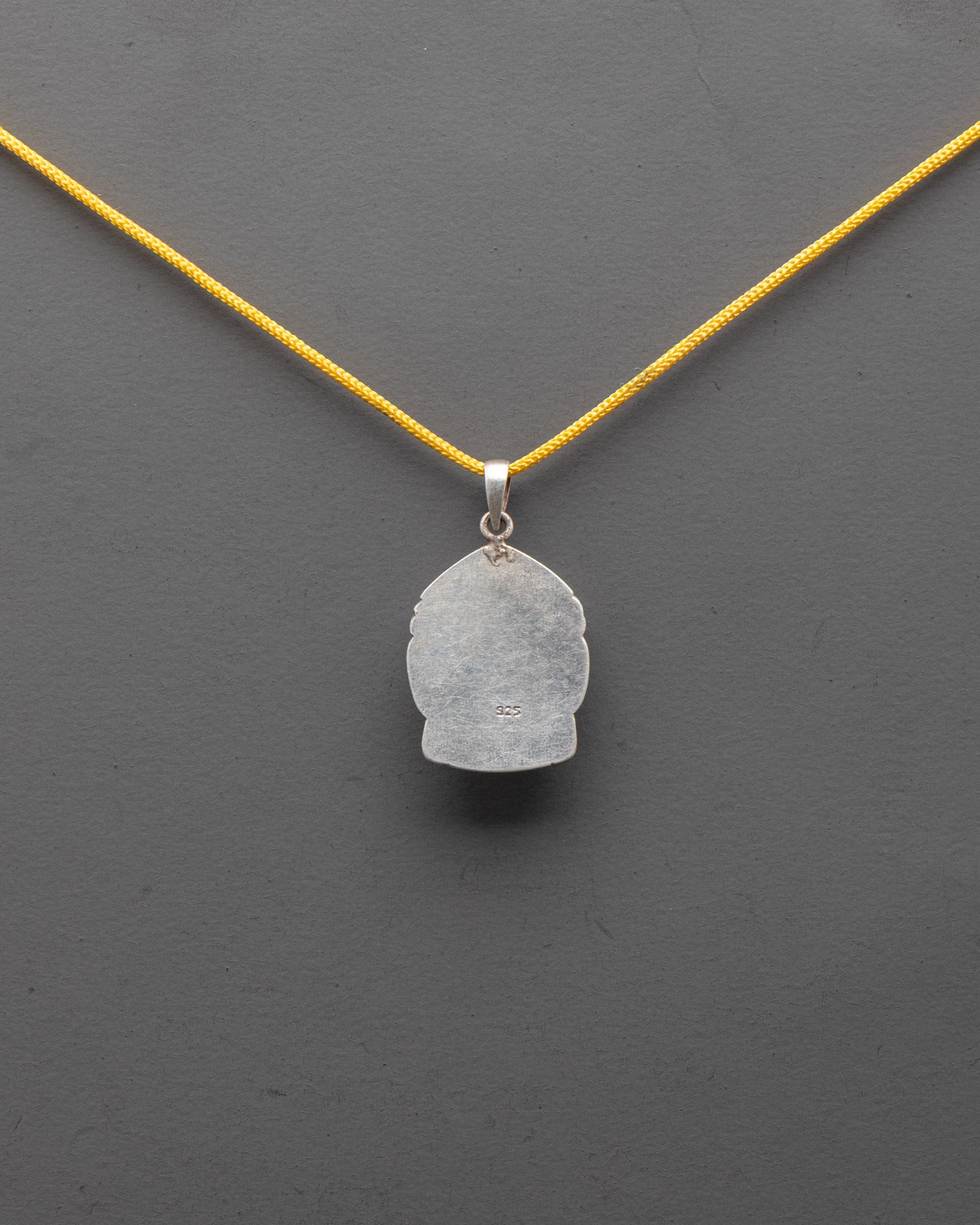 Back view of finely handcrafted silver Buddha Head Locket for spiritual protection and calmness