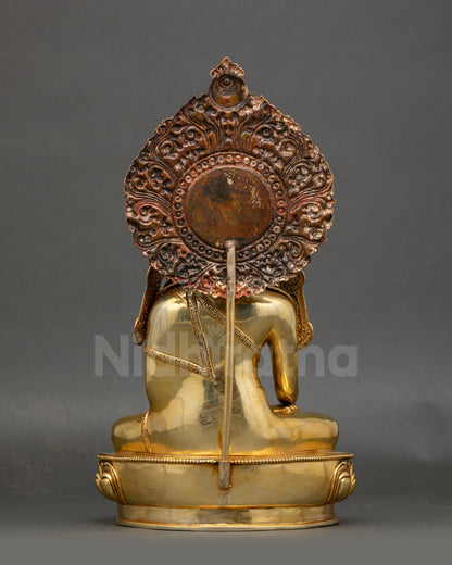 Back view of gold-gilded Jowo Shakyamuni Buddha with carved lotus base and halo