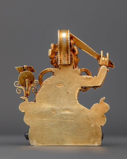Back view of gold-gilded Manjushri amulet with traditional artisan filigree patterns