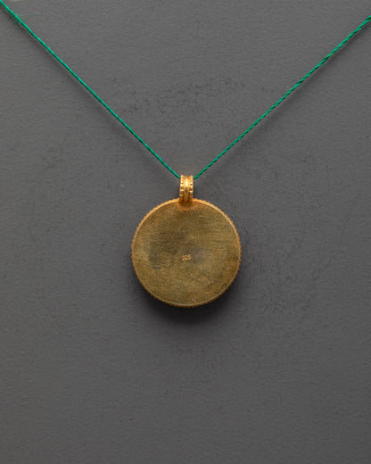 Back view of gold-plated copper Shell Locket highlighting artisan craftsmanship and finish
