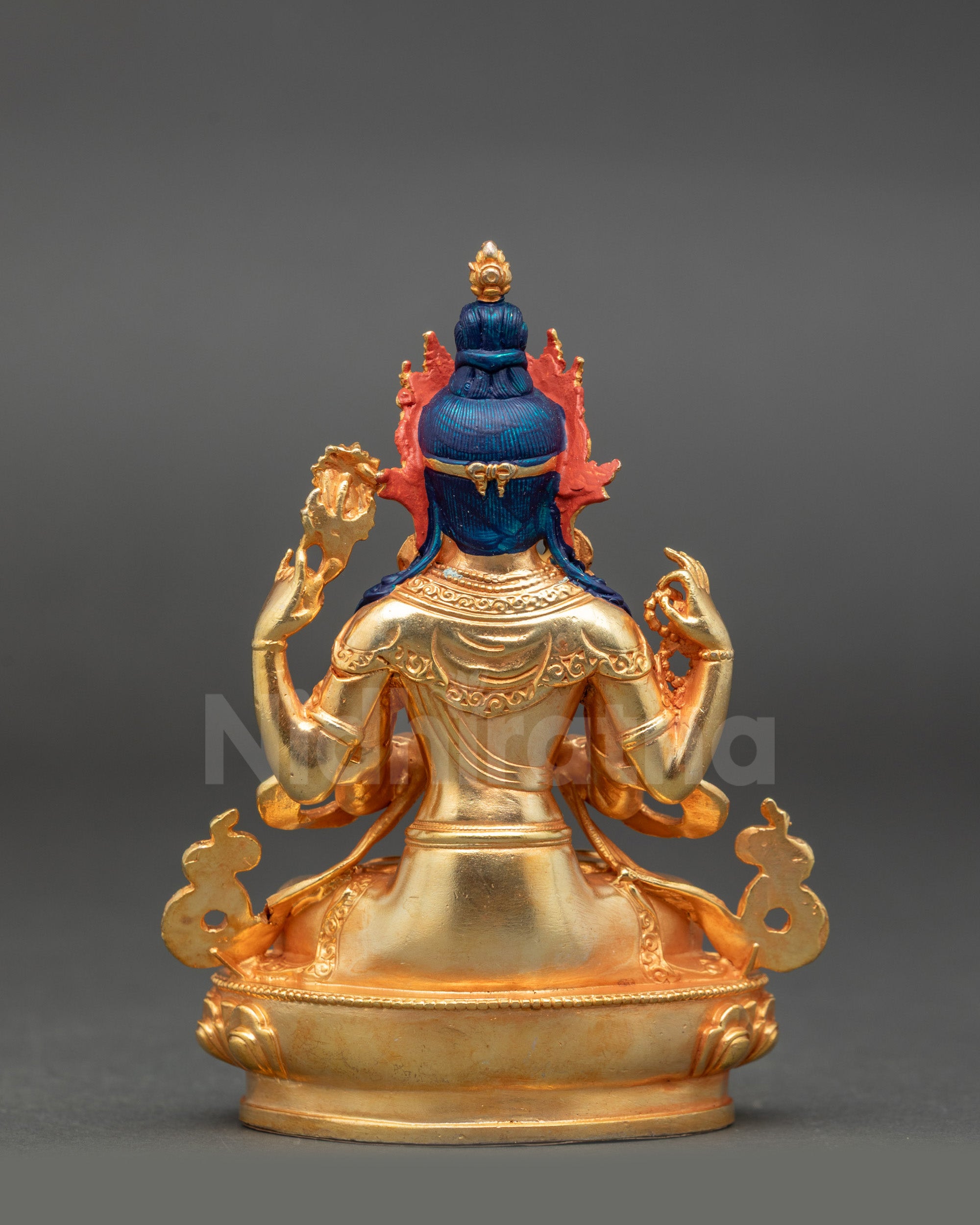 Back view of gold fire-gilded Chenrezig statue adorned with semi-precious stones