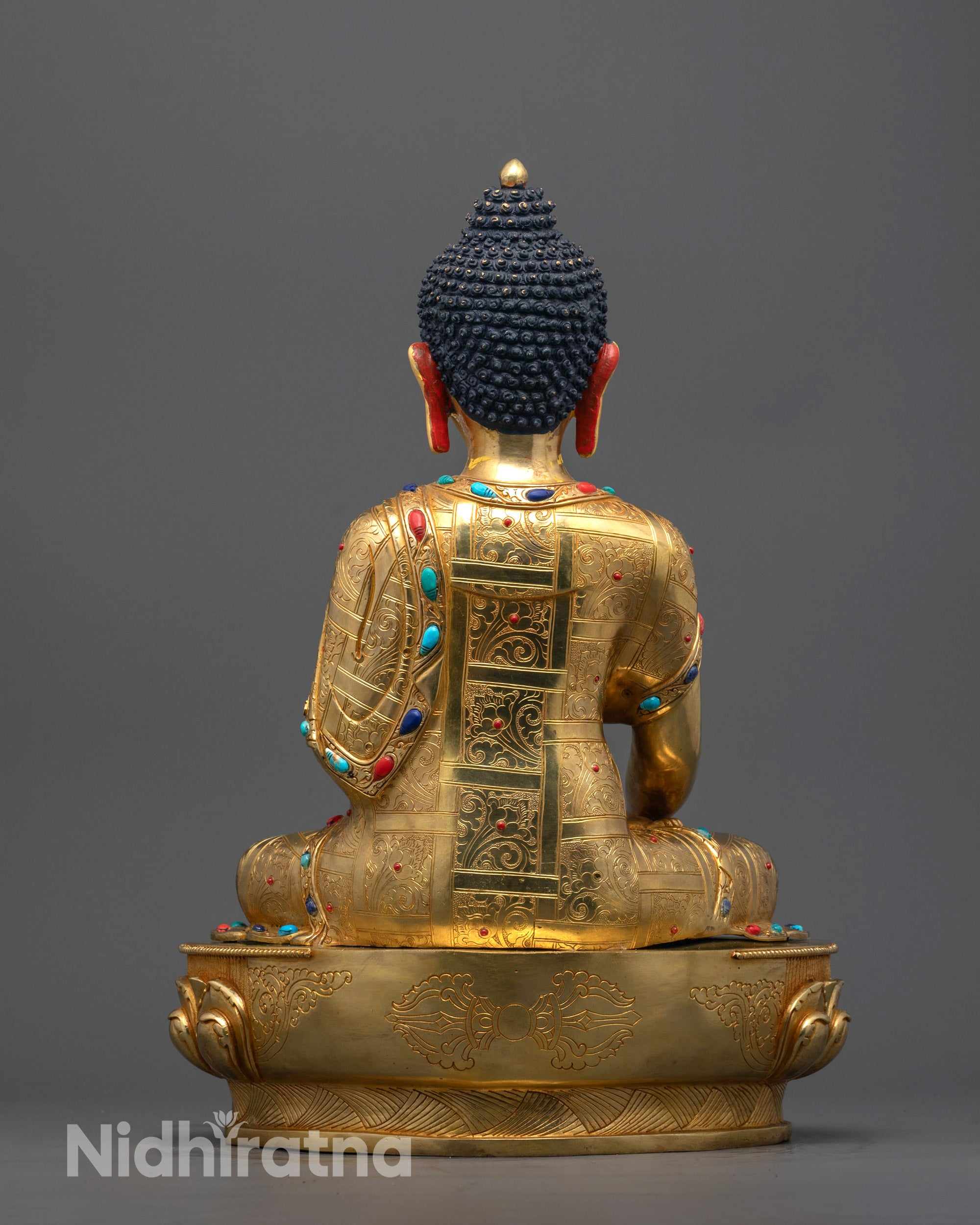 Back view of hand-carved Shakyamuni Buddha Statue on lotus pedestal