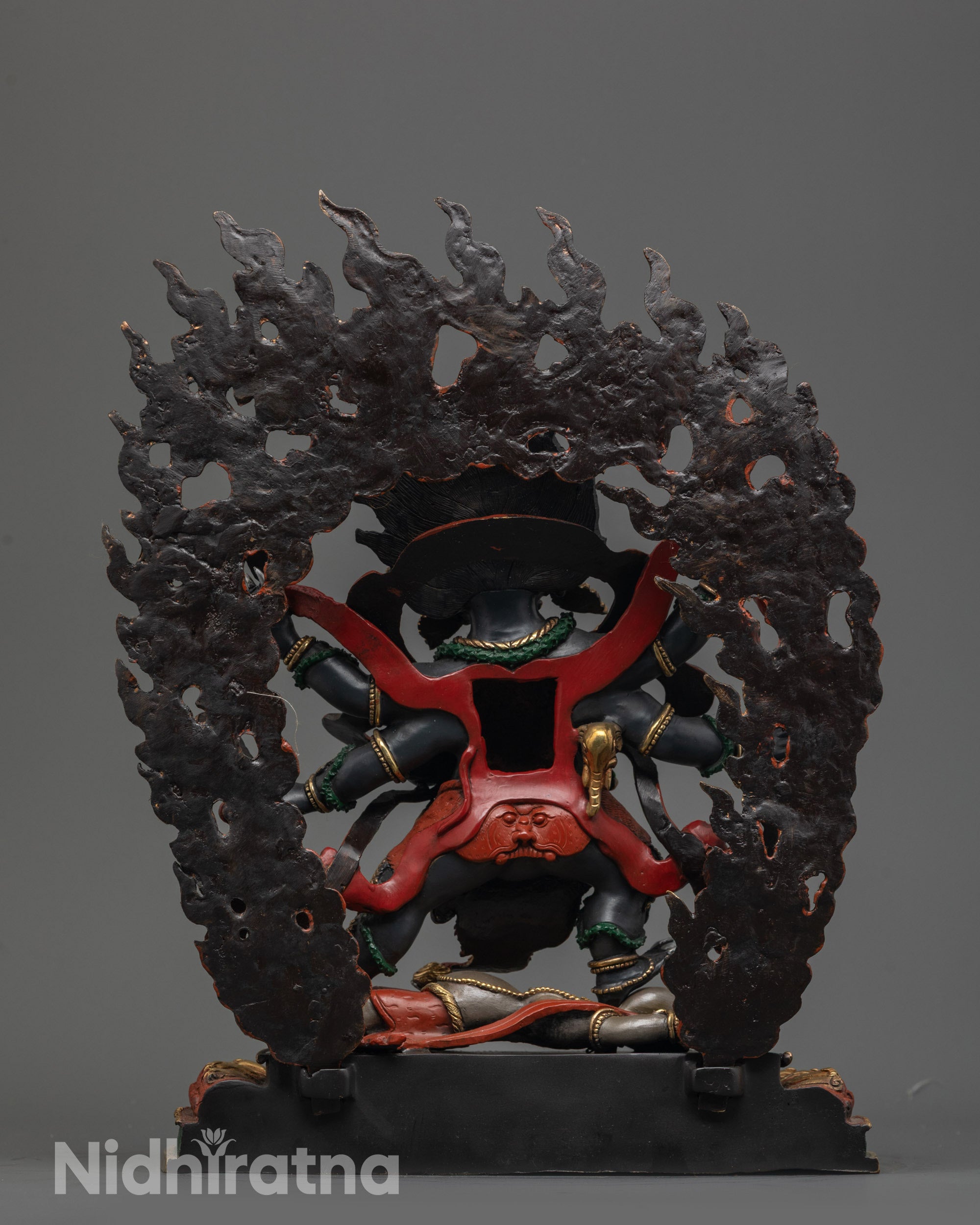 Back view of hand-carved Six-Armed Mahakala Statue highlighting intricate details