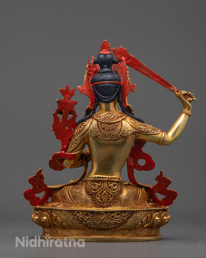 Back view of hand-carved Tibetan Manjushri Statue with elegant garlands and lotus base details