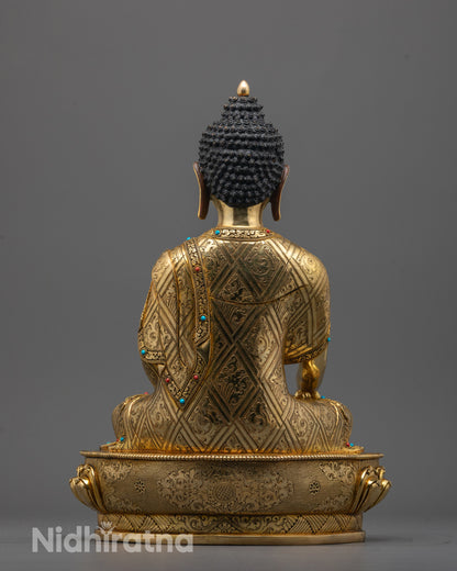 Back view of handcrafted Buddha Shakyamuni statue adorned with semi-precious stones from Nepal