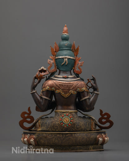 Back view of handcrafted Chenrezig Statue with detailed robe, halo, and intricate carvings


