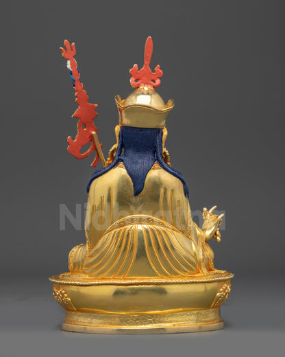 Back view of handcrafted Guru Rinpoche statue showing flowing kasaya robe