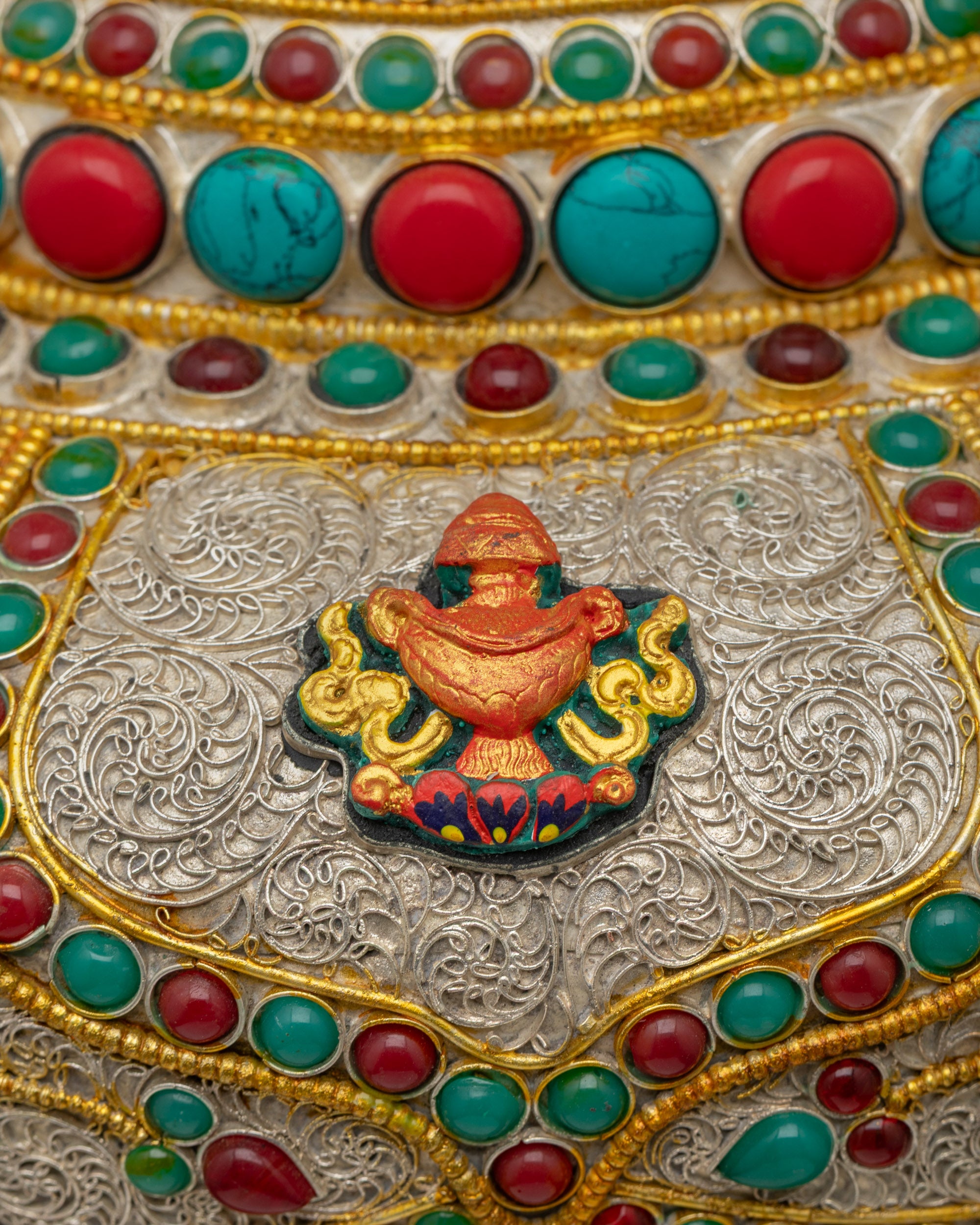 Back view of handcrafted Himalayan Flower Vase showcasing auspicious symbols and ornate gold-silver detailing made by Nepalese artisans.