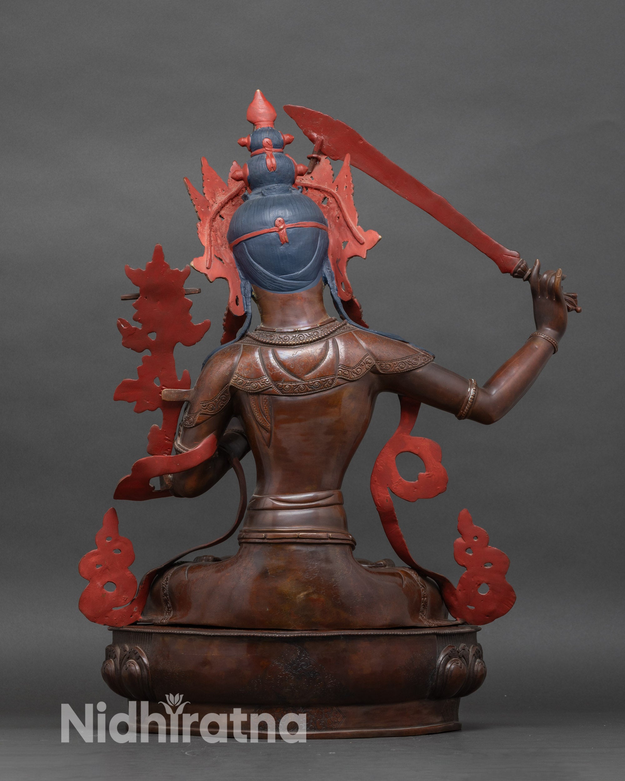 Back view of handcrafted Manjushri statue for altar and meditation, authentic Nepal art