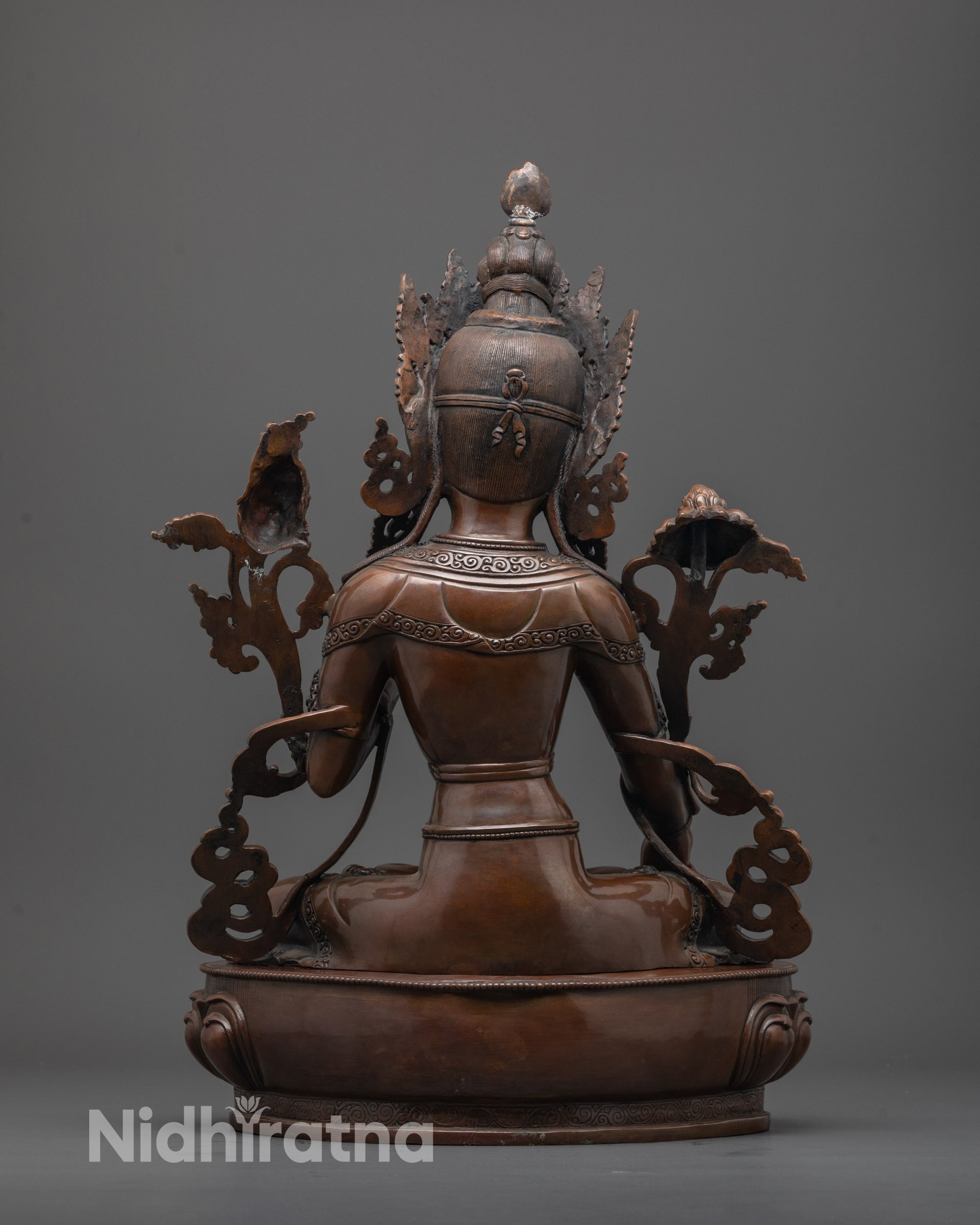 Back view of handcrafted Oxidized White Tara statue with precise lotus seat carvings